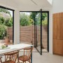 North London Victorian Villas | View of large pivot door leading to garden | Interior Designers